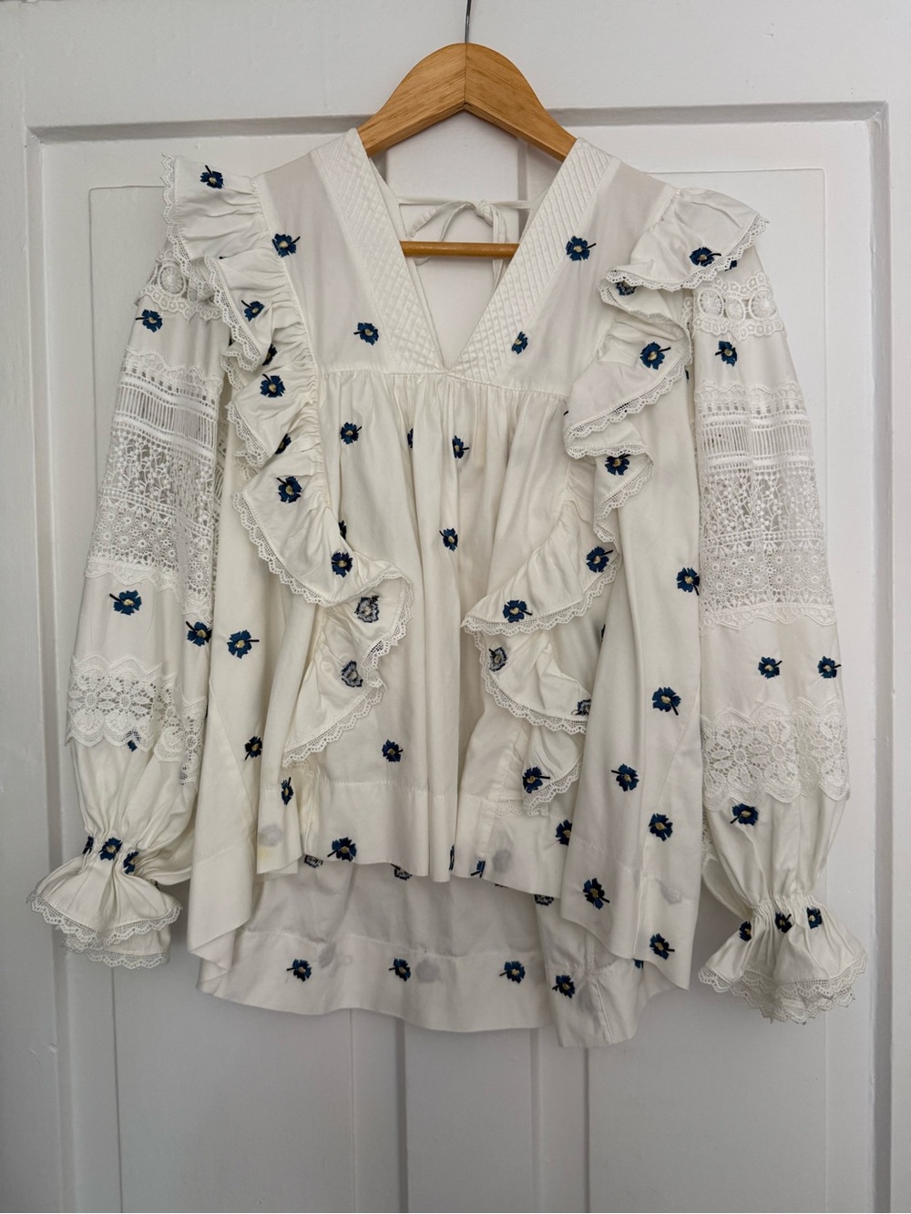 Designer Ruffle Embroidered V-Neck Blouse – White with Navy Flower Embroidery